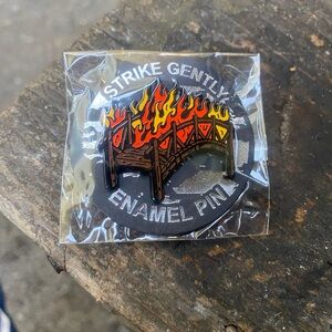 Brand New In Packaging Strike Gently Burning Bridge Enamel Pin
